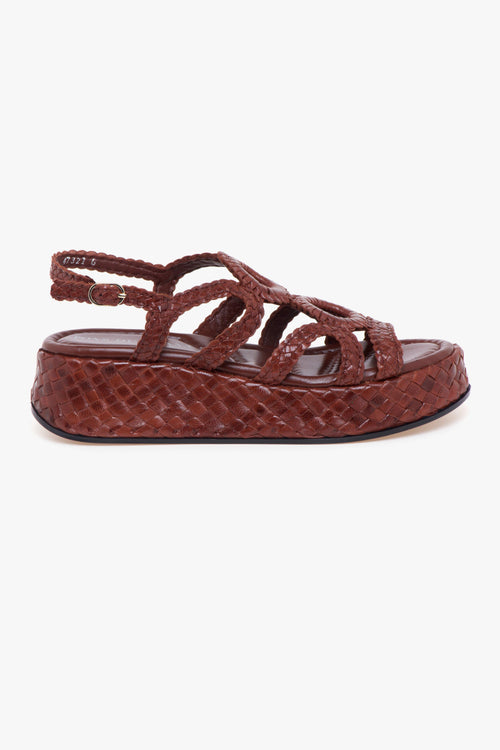 Sandalo flat in pelle intreccata e platform