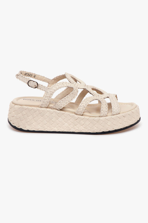 Sandalo flat in pelle intreccata e platform