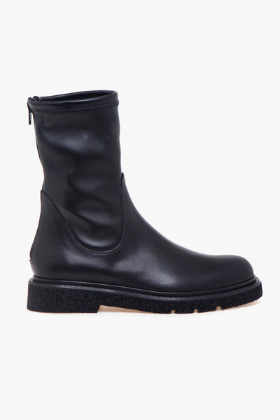 Tronchetto in pelle con gambale stretch, suola in gomma e zip