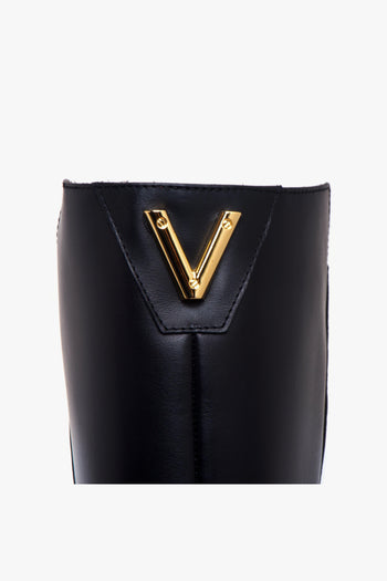 Stivale in pelle con zeppa interna e "V" media applicata dietro - 4