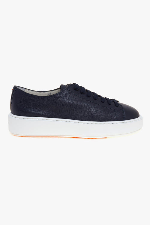 Sneaker in pelle con impunture e suola in gomma